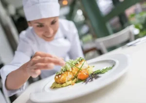 Blog 3 Chef adding Garnish to a dish